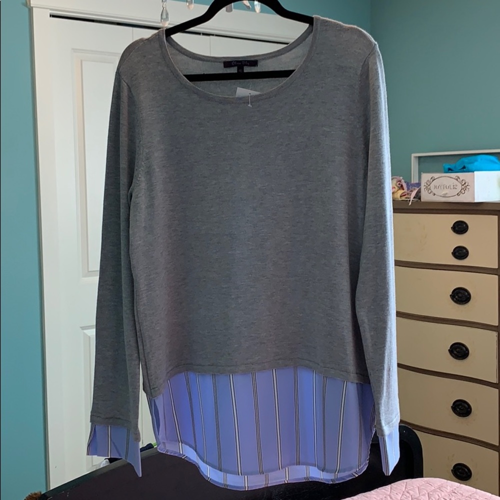 Lightweight grey top with blue shirt cuffs